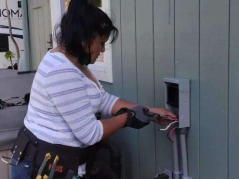 Licensed electrician wiring an exterior subpanel in West Odessa